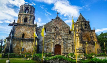 Hear a prayer at Miag-ao Church