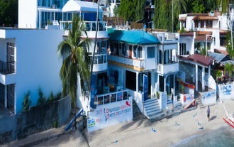 An aerial view of Arkipelago Divers and Beach Resort, which is included in this Puerto Galera town resort package