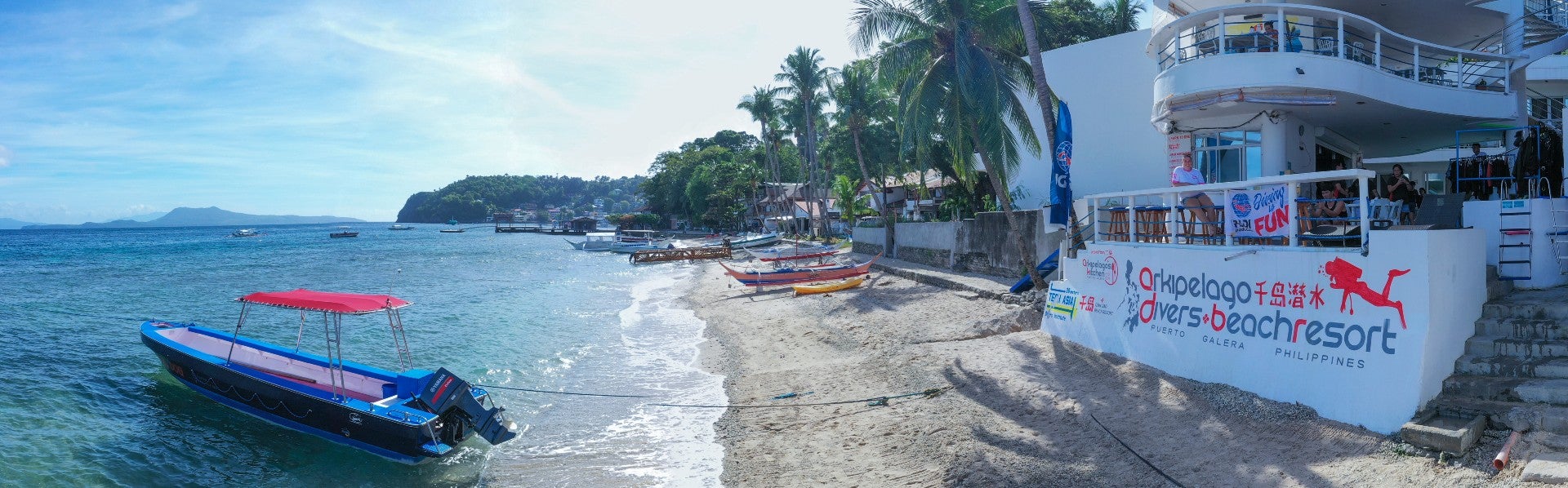 The White Beach shoreline featured in this 3-day, 2-night Puerto Galera town tour package from Manila City
