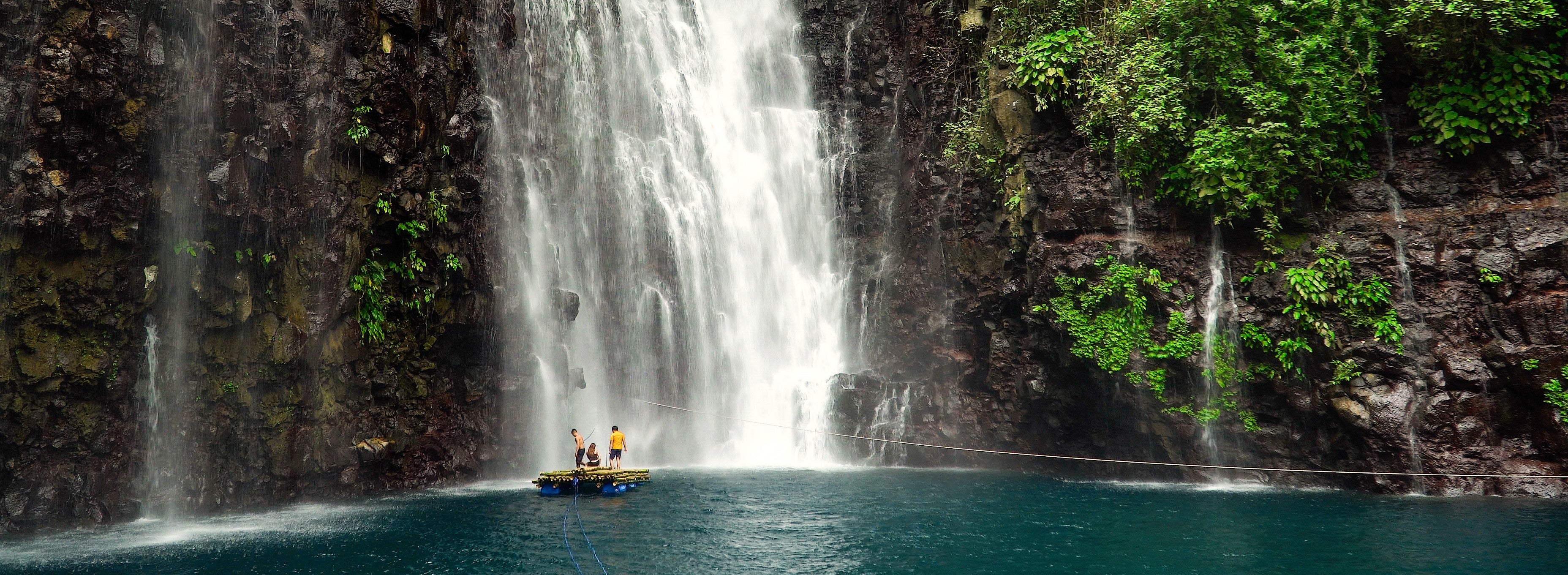 TopBannerPeople floating on raft by the Tinago Falls.jpg