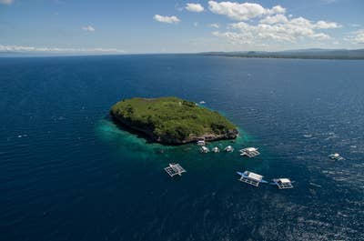 tourist swimming in Pescador Island in Moalboal