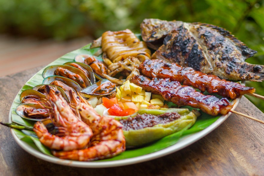 Grilled seafood and meat platter in the Philippines Grilled seafood and meat platter in the Philippines