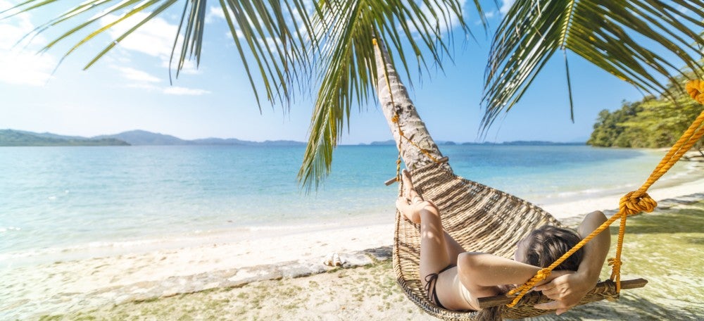 A cozy hammock at Seda Lio Resort, where you can enjoy the beauty of the town's landscapes when you book this El Nido Palawan resorts package.