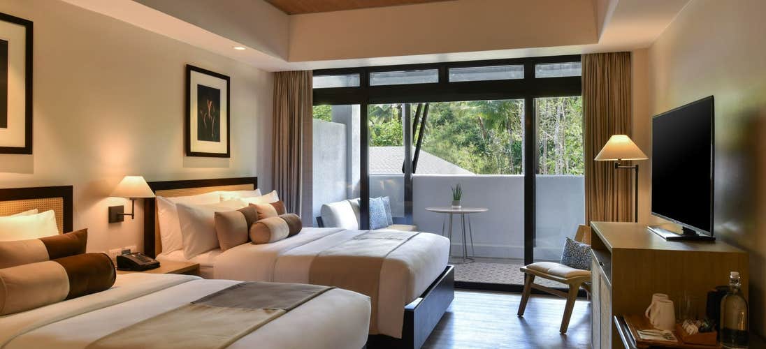 Seda Lio Hotel’s modern architecture blending with nature, available through the El Nido Palawan resort package.