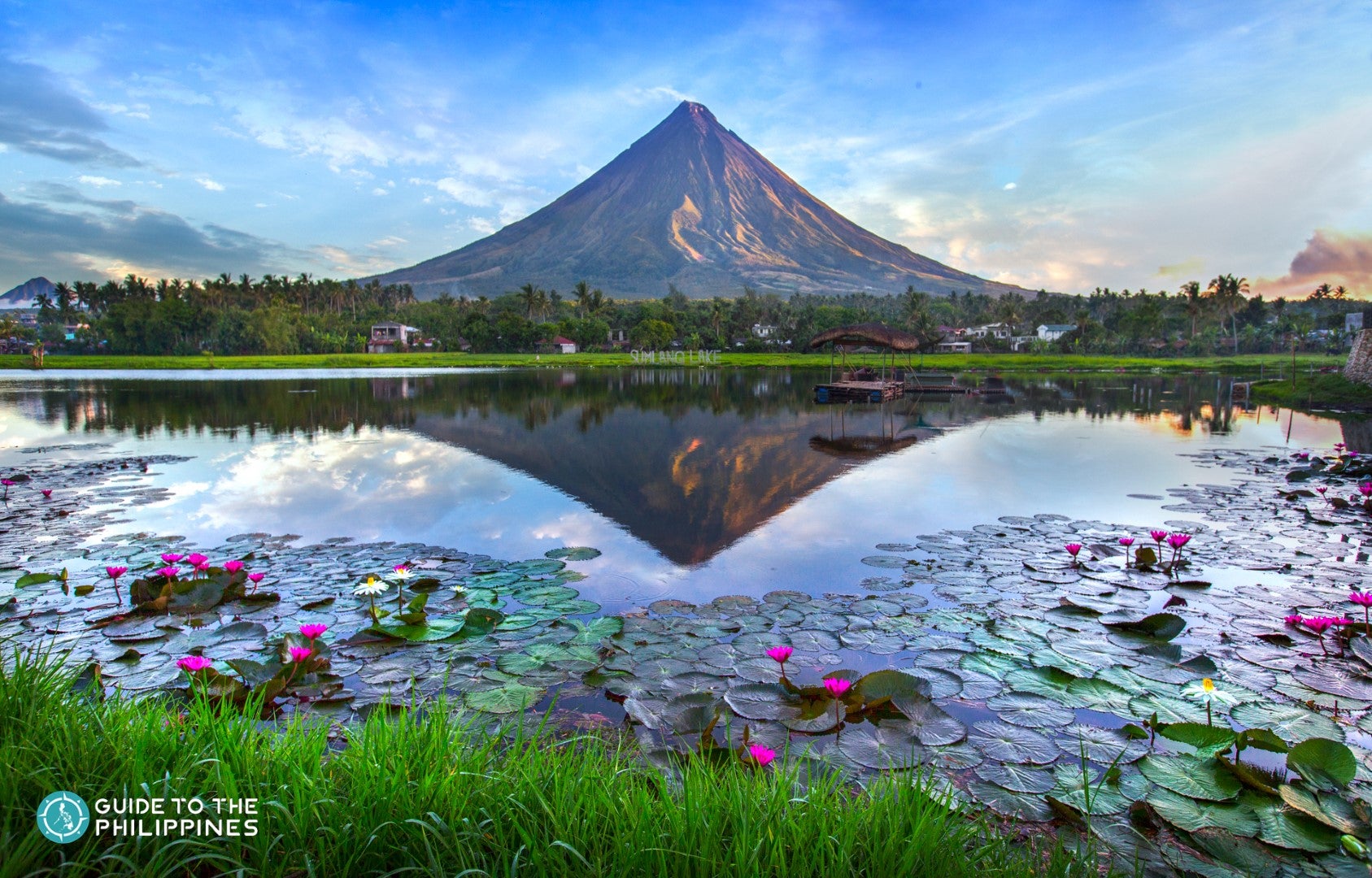 The reflection of the almost perfect cone of Mayon Volcano on Sumlang Lake.