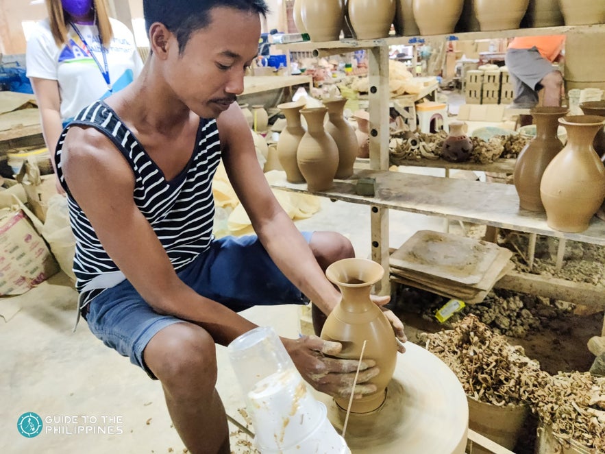 Man making a vase in PhilCeramics Arts and Crafts Center Man making a vase in PhilCeramics Arts and Crafts Center