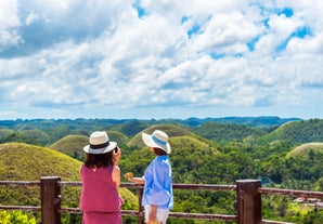 Guests at the Chocolate Hills view deck