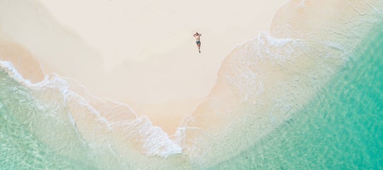 TopBanner_Tourist laying on Daku Island, Siargao-2.jpg