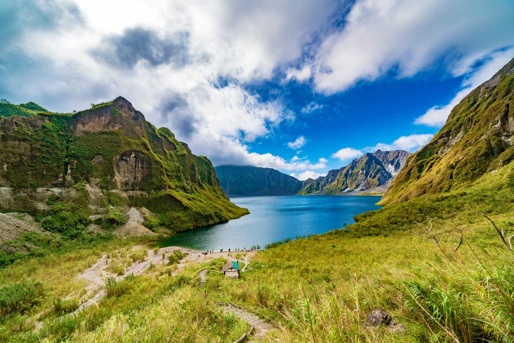 View the majestic Mount Pinatubo, with its iconic crater lake at the summit.