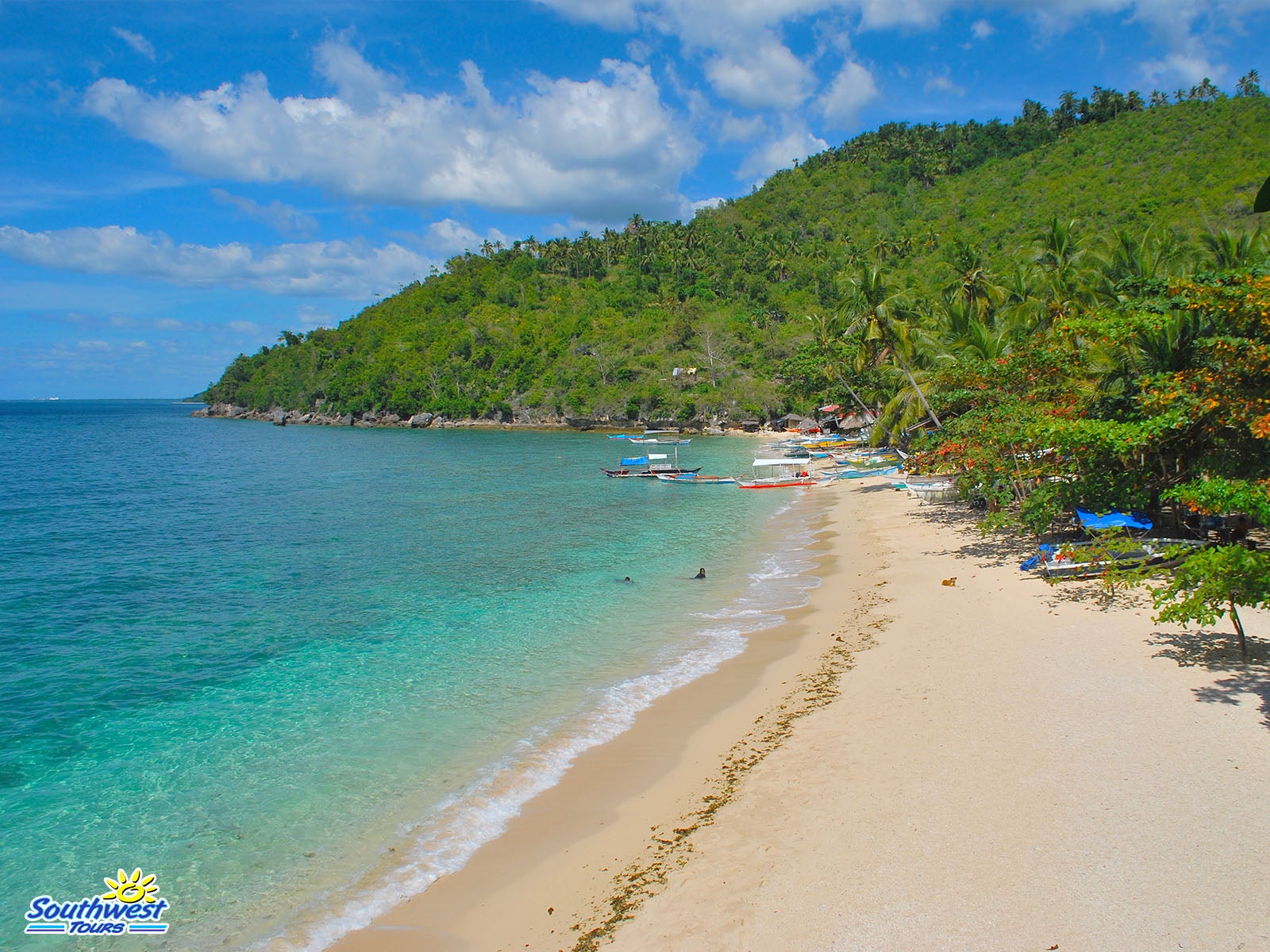 The serene waters and sand Hermit's Cove in Aloguinsan town on Cebu Island.