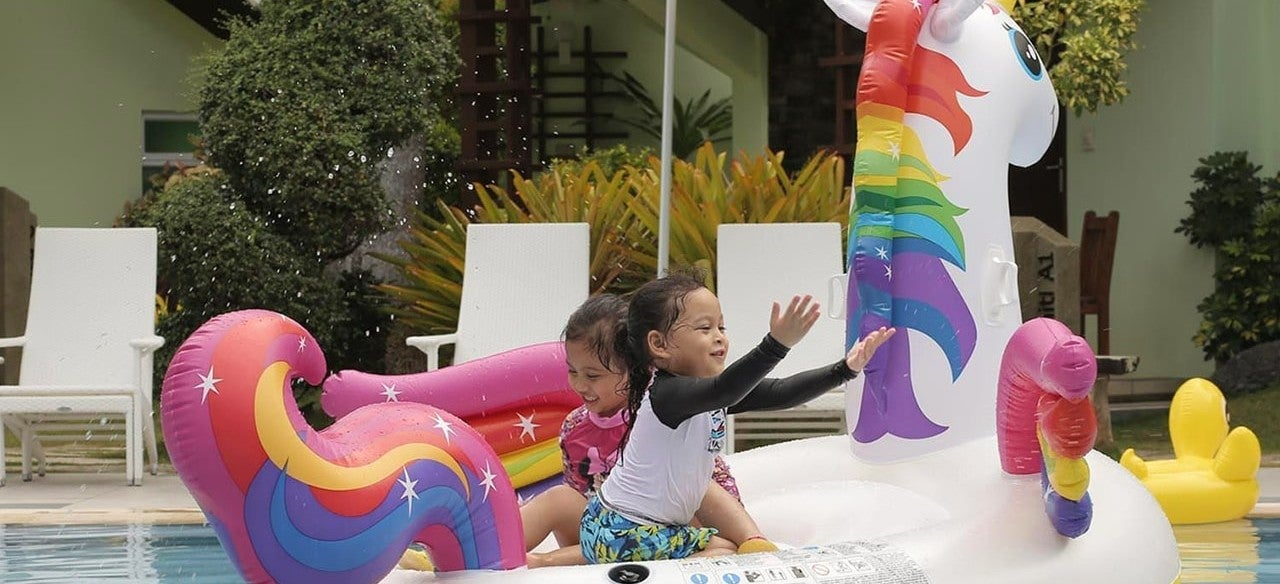 Kids swimming at Acuatico Beach Resort Laiya, San Juan, Batangas