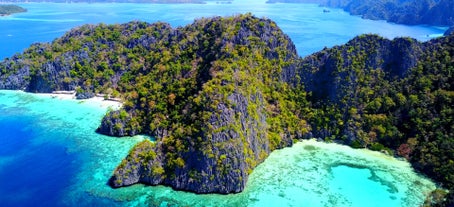 Visit Twin Lagoon in Coron, perfect for swimming and in the most picturesque location for your island hopping.