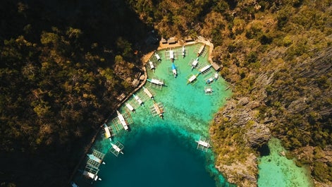 Try island hopping to Kayangan Lake in Coron