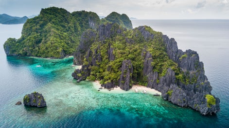 Visit the popular spot for snorkeling because of its colorful marine life, Shimizu Island in El Nido, Palawan