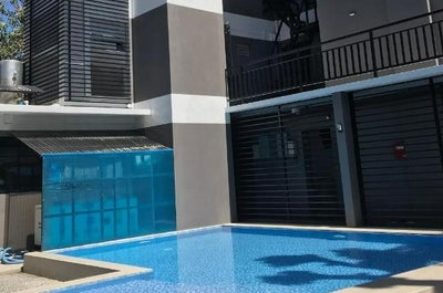 Have a deep relaxation by the pool of UNWND Flats Dumaguete