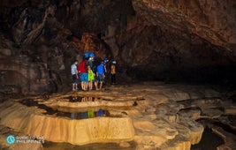 Tourists explore Bagumbungan Cave