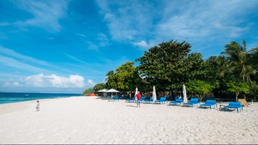 Pristine white sand beach of Club Paradise Coron, Palawan