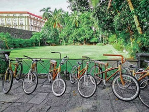 Eco-friendly bicycles neatly lined up, ready for this bamboo bike tour in Intramuros old town