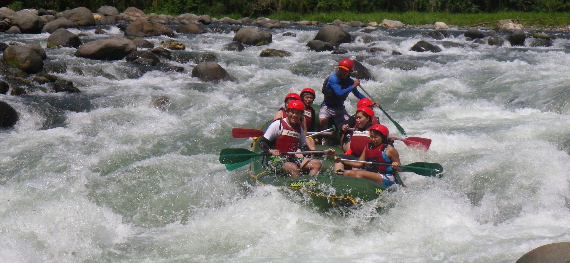 Travelers having a blast on the whitewater rafting tour in Cagayan de Oro City.