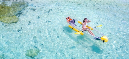 A woman on a peaceful crystal kayak ride in Boracay Island