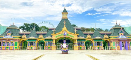 You’ll pass through the whimsical entrance of the Enchanted Kingdom theme park as you use your day pass