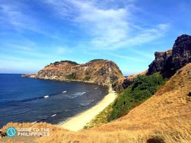 Capones Island, a highlight of this island hopping tour in Zambales Province, features stunning rock formations and scenic coastal views.