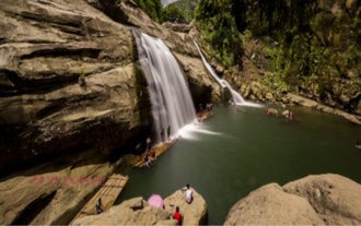 The scenic Tangadan Falls, surrounded by lush greenery, is featured in this 3-day, 2-night tour package to La Union Province.