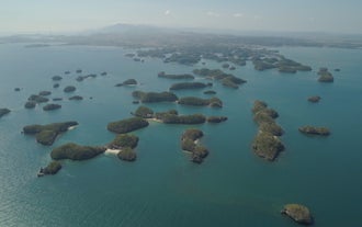 A scenic aerial shot of Hundred Islands, which you will visit in this overnight tour package from Manila City