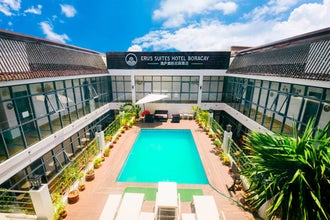 With this affordable travel package in the Philippines, you can enjoy Erus Suites’ amenities, including a swimming pool.