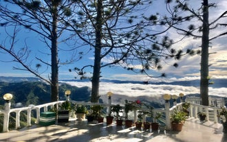 A scenic viewpoint overlooking a valley, capturing the tranquility of this private Tour of Buda Marilog District’s nature spots in Davao City.