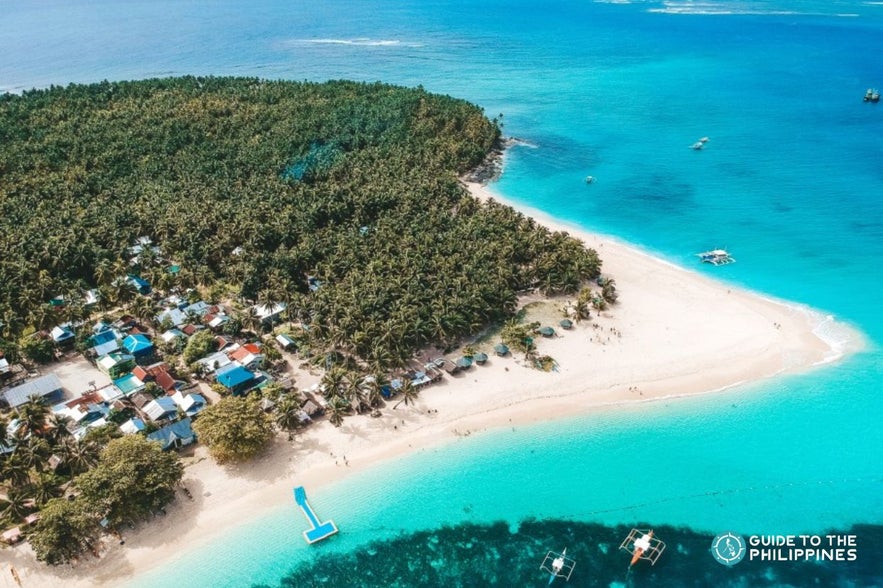 Daku Island, one of the stops in a Siargao island hopping tour Daku Island, one of the stops in a Siargao island hopping tour
