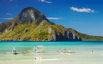 Visit Cadlao Island’s pristine shores and crystal-clear lagoons during this tour package to El Nido and Coron Towns with airfare.