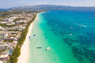 Enjoy Boracay's White Beach with its pristine white sand, crystal-clear waters, and stunning sunsets.