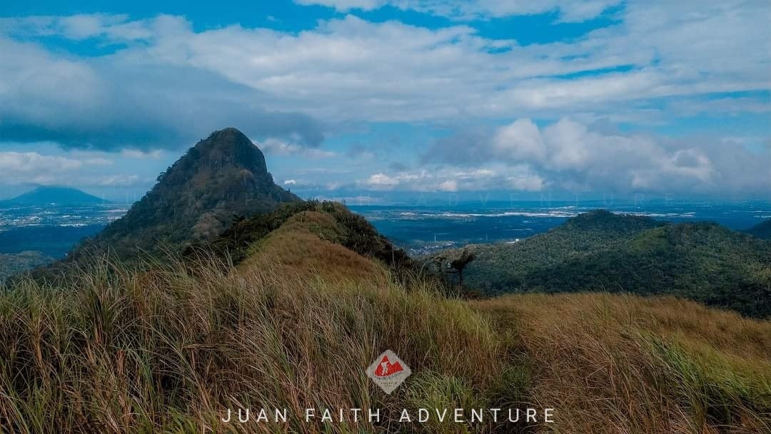 The breathtaking mountain view from the summit of Mount Malarayat, a popular destination for Batangas Province hiking trips