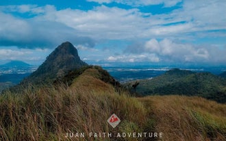 The breathtaking mountain view from the summit of Mount Malarayat, a popular destination for Batangas Province hiking trips