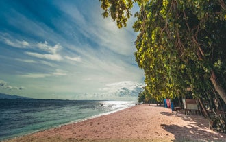 Relax on the picturesque shores of the Pink Beach with this tour package in Zamboanga City.