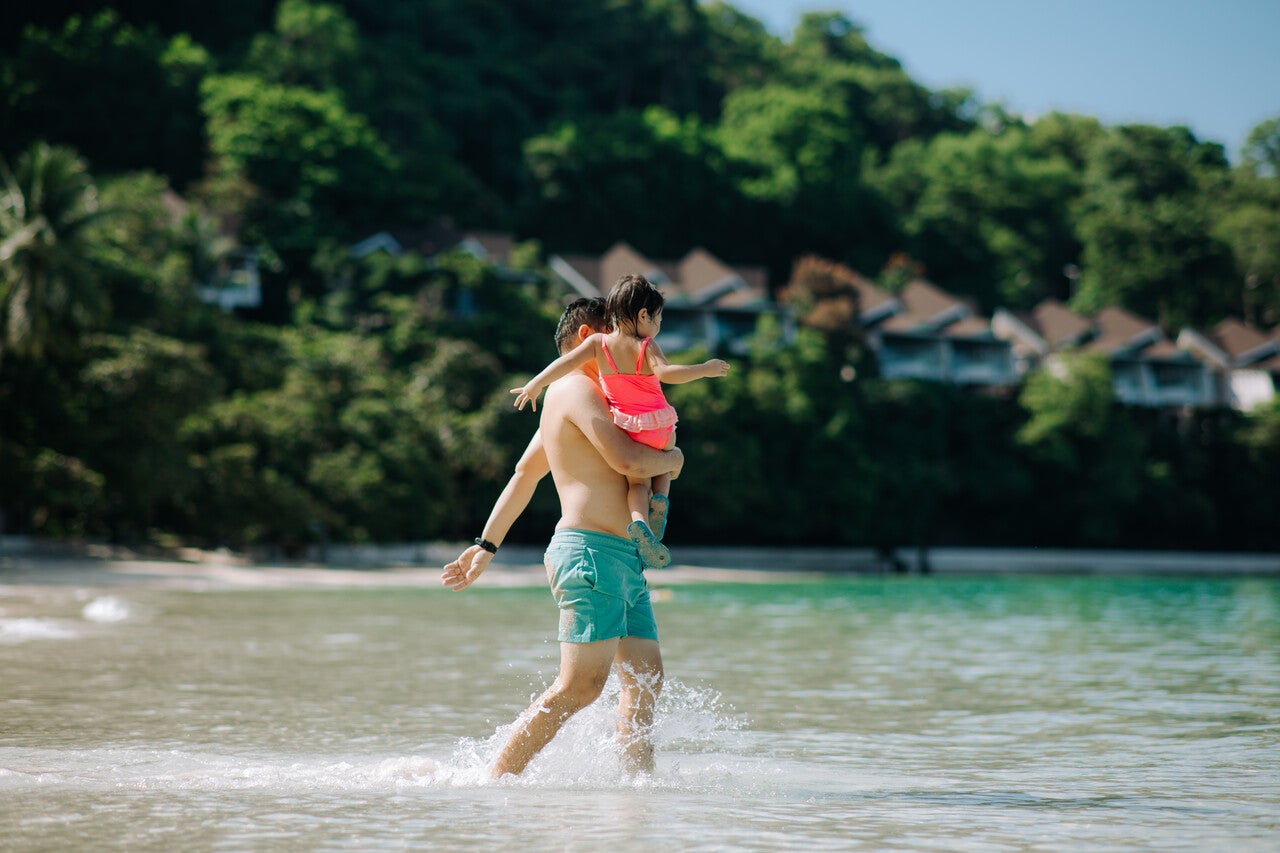 A dad with his kid at Dakak beach