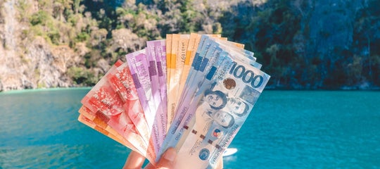 Top banner-PH money in front of an island.jpg