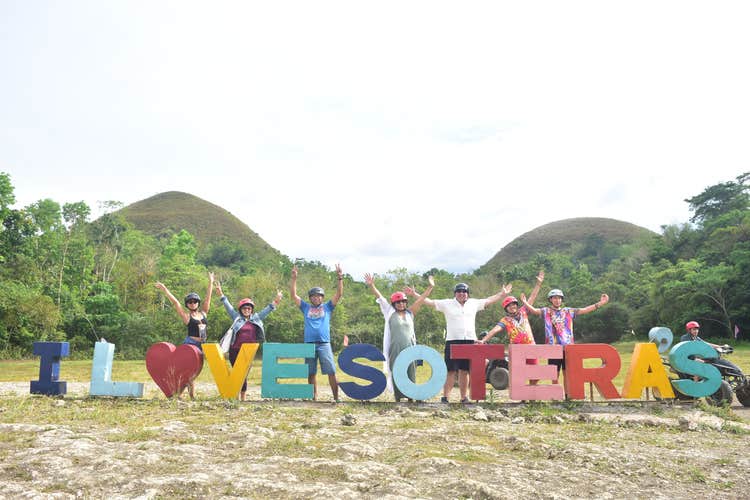 Exploring the Chocolate Hills of Bohol Island on an off-road buggy car ride during a fun-filled tour.