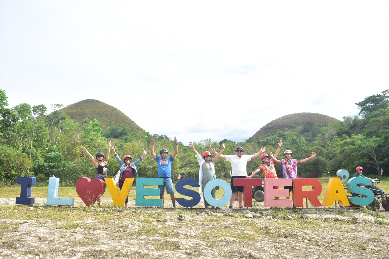 Exploring the Chocolate Hills of Bohol Island on an off-road buggy car ride during a fun-filled tour.