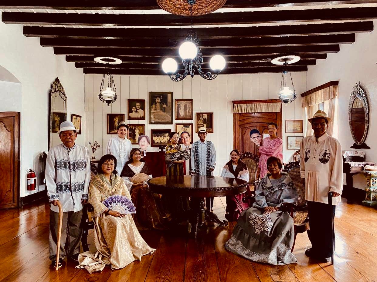 A big family in traditional Filipino attire posing for photos inside Villa Angela Heritage House in Vigan City