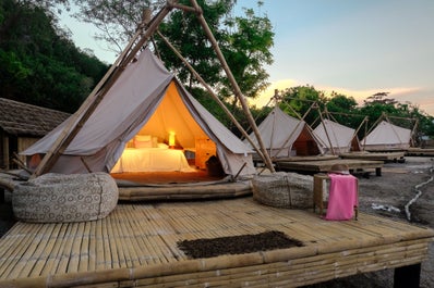 Wake up inside your glamping tent and hear the sounds of nature