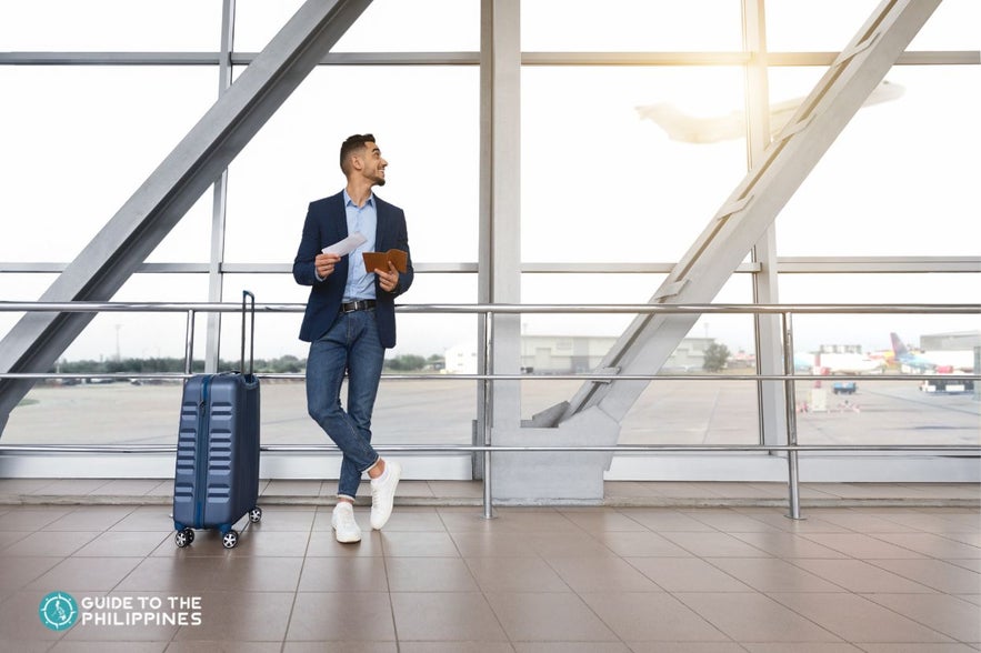 Man waiting for airplane Man waiting for airplane