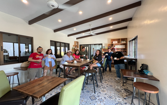 Tourists enjoying a cup of coffee during a coffee tour near Tagaytay City