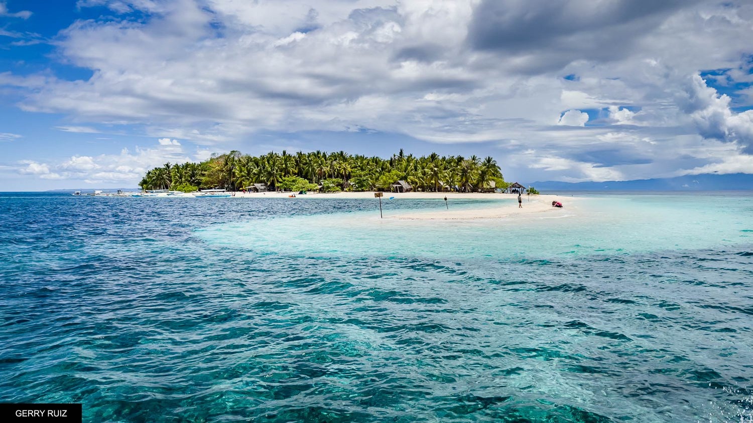 White sand beach and turquoise waters captured during this private Cuatro Islas Islands tour in Leyte Province.
