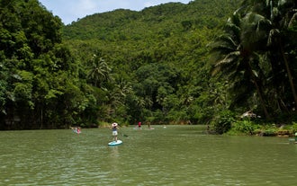 Learn how to stand up paddle in Bohol's Loboc River