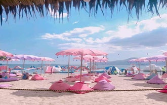 Relax during your Subic Bay beach resort day tour by lounging on colorful daybeds at Inflatable Island.