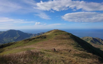 Stand atop a scenic summit during the Cawag Hexa day hike.