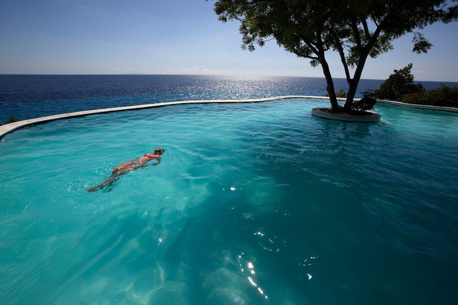 Enjoy a refreshing swim in the infinity pool at Bluewater Sumilon Island Resort with this day tour.