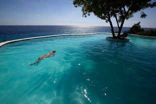 Enjoy a refreshing swim in the infinity pool at Bluewater Sumilon Island Resort with this day tour.